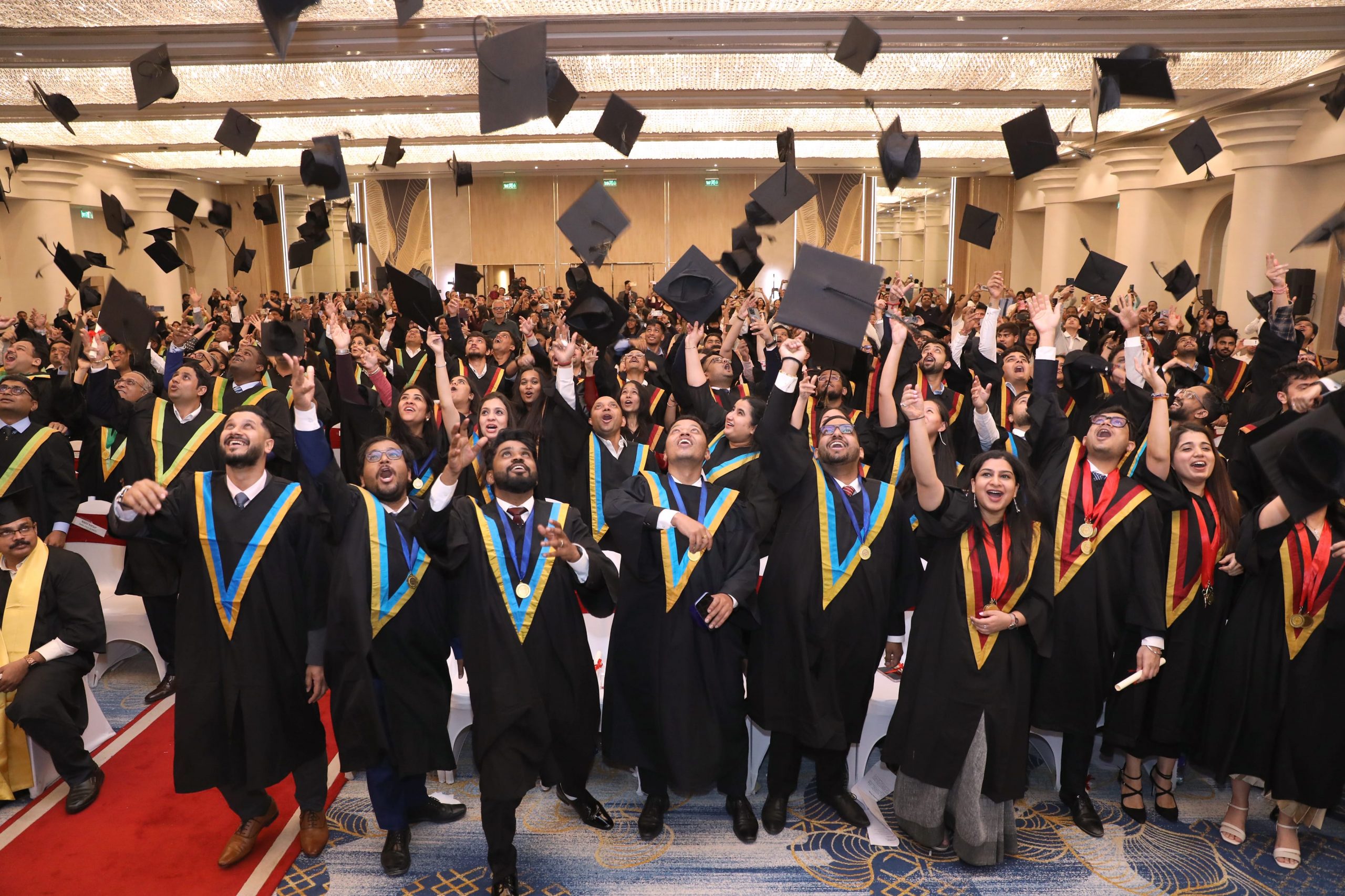 S P Jain Global graduates celebrating at commencement.